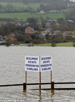 building on floodplains causes more flood damage to houses